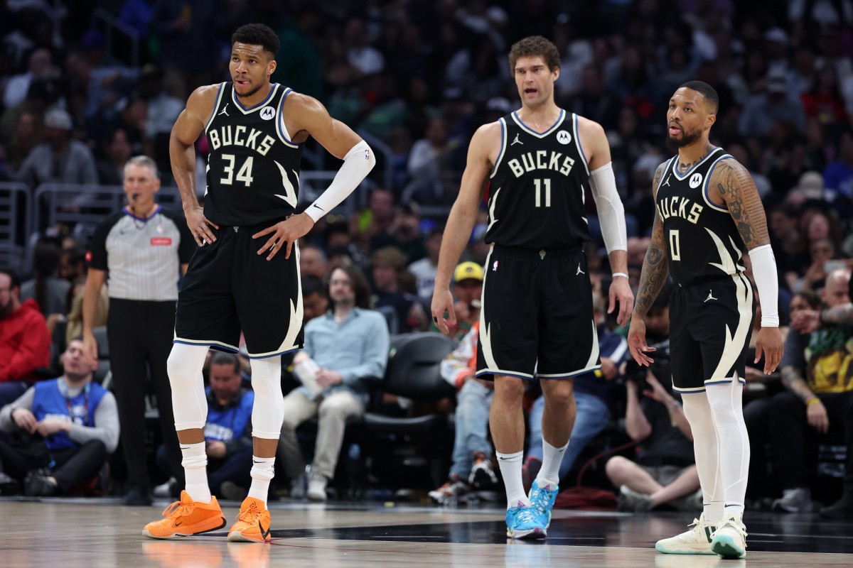 Milwaukee Bucks forward Giannis Antetokounmpo (34) center Brook Lopez (11), and guard Damian Lillard (0)